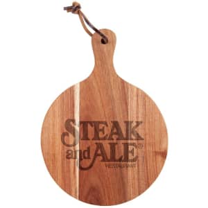 A round wooden cheeseboard with a handle, featuring a logo and a natural finish.