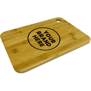 A large bamboo cutting board with a circular branding area and a hole for hanging. The surface is smooth and light brown.