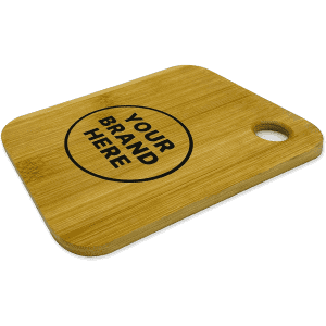 A small bamboo cutting board featuring a circular area for branding and a handle cutout.