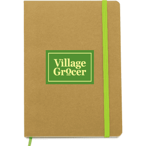 A tan notebook with a green elastic band and a logo on the front. It has a simple, minimalist design.