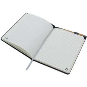 A black A5 notebook with lined pages, featuring a ribbon marker and a small logo on the cover.