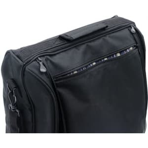 A black picnic basket with a textured exterior and a zippered compartment on top. It has a handle for easy carrying.