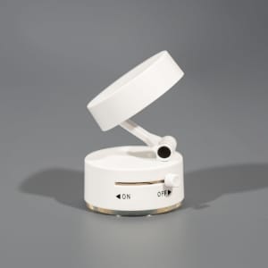 A white recycled ABS vacuum suction magnetic phone stand with an adjuster and an on/off switch.