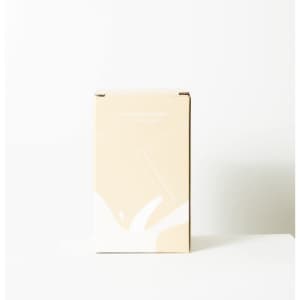 A drink cooler in a light brown box, featuring a simple design and a logo.