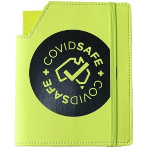 A bright yellow leatherette notebook with an elastic band and a logo on the cover.