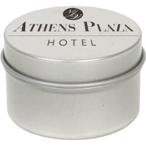 A silver tin candle with a lid, featuring a logo and the text "Athens Plaza Hotel".