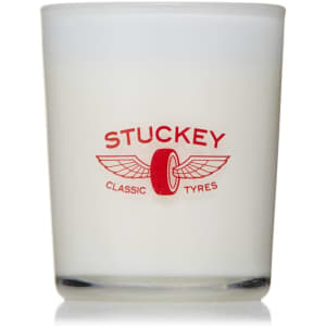 A glass candle with a frosted finish, featuring a red logo and white wax.