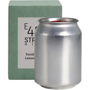 A silver can candle with a green packaging box, featuring a logo. The scent is eucalyptus and lemon.