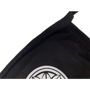 A black cotton face mask with a silver logo on the front and a stitched edge.