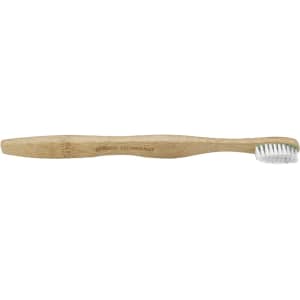 A bamboo toothbrush with a wooden handle and white bristles, featuring a logo on the side.