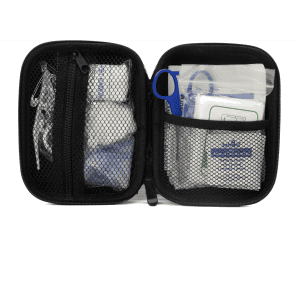 A compact black first aid kit opened to reveal various medical supplies, including dressings, antiseptics, and tools.