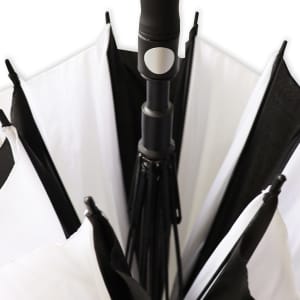 A black and white umbrella with a central handle, featuring a sleek design and a branding logo.