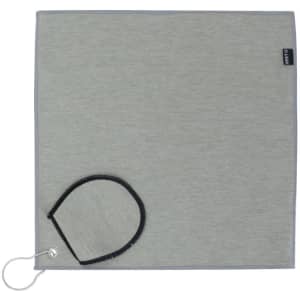 A grey golf towel with a black loop and branding tag, featuring a sleek and simple design.