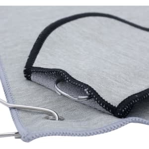 A grey golf towel with a black trim and a metal grommet for attachment. It features a smooth texture.