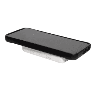 A wireless charging power bank in white with a sleek design supporting a black smartphone on top.