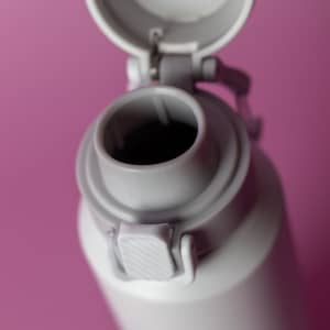 A drink bottle in grey with a cap and a spout, featuring a logo on the side.