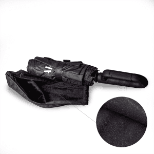 A black foldable umbrella with a handle, featuring a compact design and a smooth surface texture.