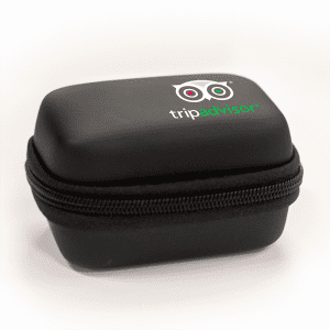 A black zippered case with a logo on the top, designed for travel accessories.