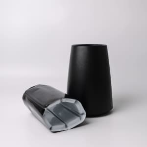 A black Catalina Wine Cooler with a sleek design and a glossy base. It features a logo on its surface.