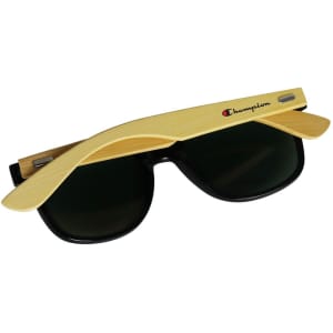 Bamboo sunglasses with black lenses and a timber effect frame, featuring a logo on one side.
