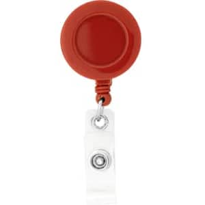 A round badge holder in red, featuring a retractable reel and a clear strap for attachment.