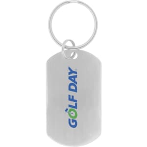 A silver dog tag keychain featuring a logo in blue and green colours. It has a metal ring for attachment.