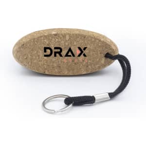A cork keychain in an oval shape with a black rope attached and a metallic keyring. It features a logo.