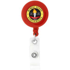 A round badge holder in red with a clear strap and a logo on the front.
