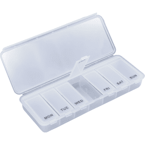 A transparent pill box with separate compartments for each day of the week. It features a clear lid and branding.