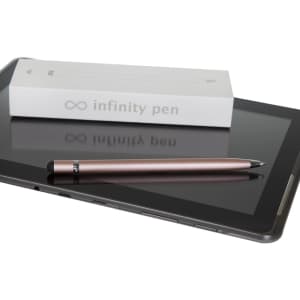 A metal Infinity Pen in rose gold rests beside a tablet and its packaging on a glossy surface.