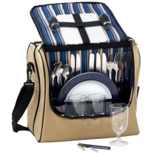 A tan picnic basket featuring cutlery, plates, glasses, and a wine opener, with a striped interior and a logo.