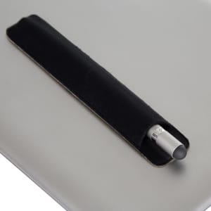 A metal pen with a silver tip, resting in a black leather holder on a grey surface. The image features branding.