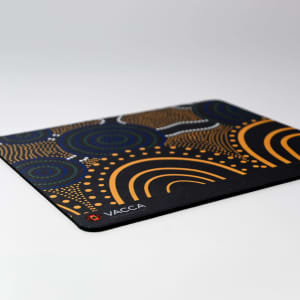 A patterned mouse mat featuring blue, orange, and black colours with a logo in one corner.