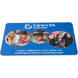 A blue mouse mat featuring three circular images of children and a logo.