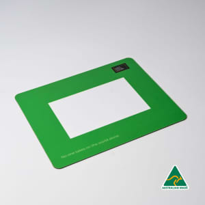 A green mouse mat featuring a central photo frame cut-out and a logo in one corner.