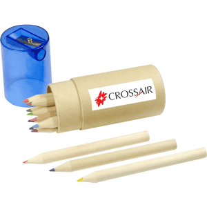 A cylindrical brown container holding several coloured pencils, with a blue sharpener beside it. The container has a logo.