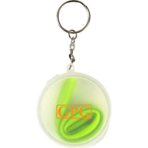 A green reusable silicone straw coiled inside a clear round case with a keychain attachment.