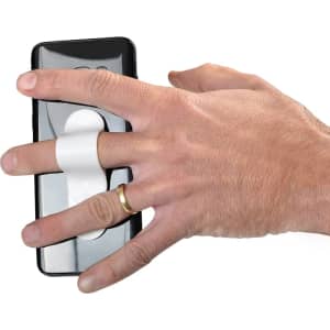 A black smartphone with a white strap attached, held by a hand wearing a gold ring.