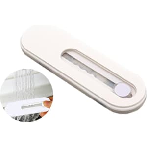 A white smartphone strap with a sliding mechanism, featuring a circular button and an opening to attach to devices.
