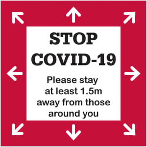 A red floor decal sticker featuring white arrows and black text promoting social distancing measures.