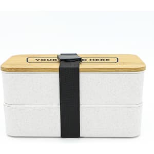 A two-layer lunch box in white with a bamboo lid, secured by a black strap. It features a logo on the top.