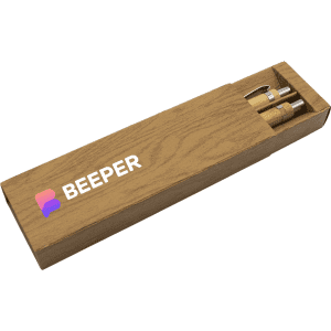 A bamboo pen set in a wooden box, featuring two pens and a logo on the box.