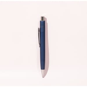 A blue ballpoint pen with a silver tip and clip, featuring a logo on its body.