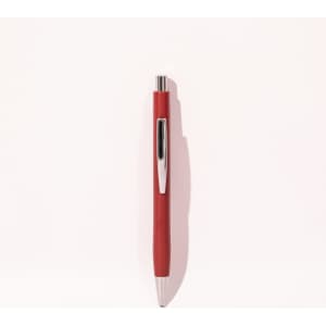 A red ballpoint pen with a silver clip, featuring a sleek design and a shiny finish.