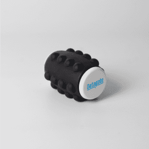A black Whirl Popper Spinner featuring a white top with a logo, designed as a novelty item for fun and games.