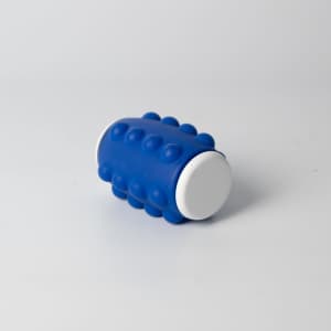 A blue Whirl Popper Spinner with textured bumps and white ends, featuring a logo on one side.