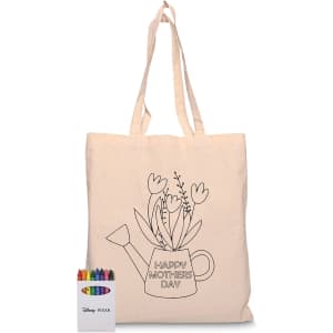 A beige calico tote bag featuring a watering can design with flowers. Includes a pack of colourful crayons.