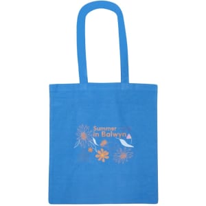 A blue tote bag featuring colourful floral designs and a logo. It has long handles for easy carrying.