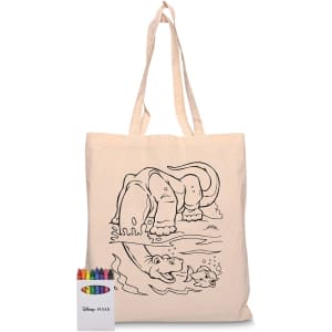 A calico tote bag featuring a line drawing of an elephant by water, accompanied by a set of coloured crayons.