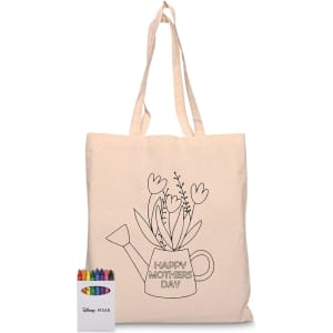 A natural calico tote bag with a floral watering can design and a set of vibrant crayons in various colours.